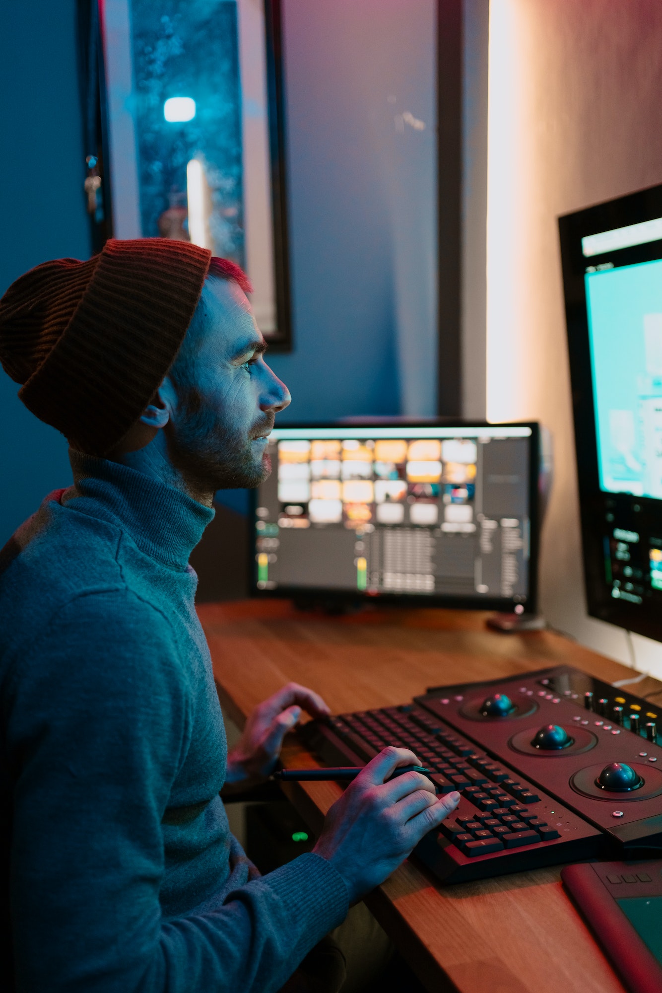 Male Video Editor Working on His Personal Computer with Big Display